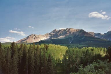 Wilson Peak tucked behind a ridgeline during the drive into camp